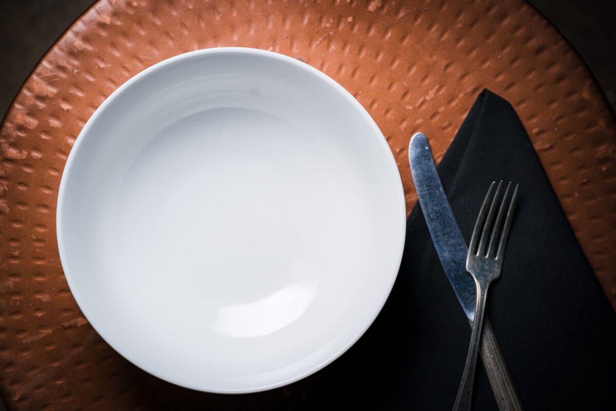 Directly above shot of plate with fork and knife on table,Tulsa,Oklahoma,United States,USA