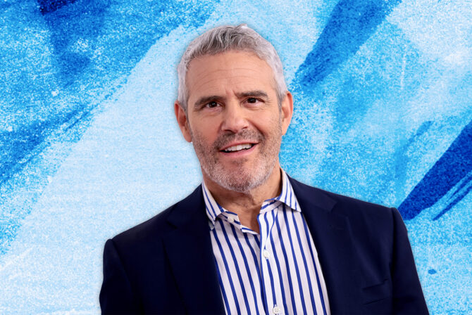 Andy Cohen on a blue textured background.