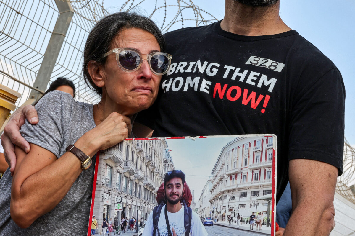 Rachel Goldberg and Jonathan Polin, parents of Israeli hostage Hersh Goldberg-Polin, attend a demonstration by the families of the hostages taken captive in the Gaza Strip since the October 7 attacks by Palestinian militants calling for the hostages' release, near Kibbutz Nirim in southern Israel by the border with Gaza on August 29, 2024 amid the ongoing conflict in the Palestinian territory between Israel and Hamas. (Photo by JACK GUEZ / AFP)